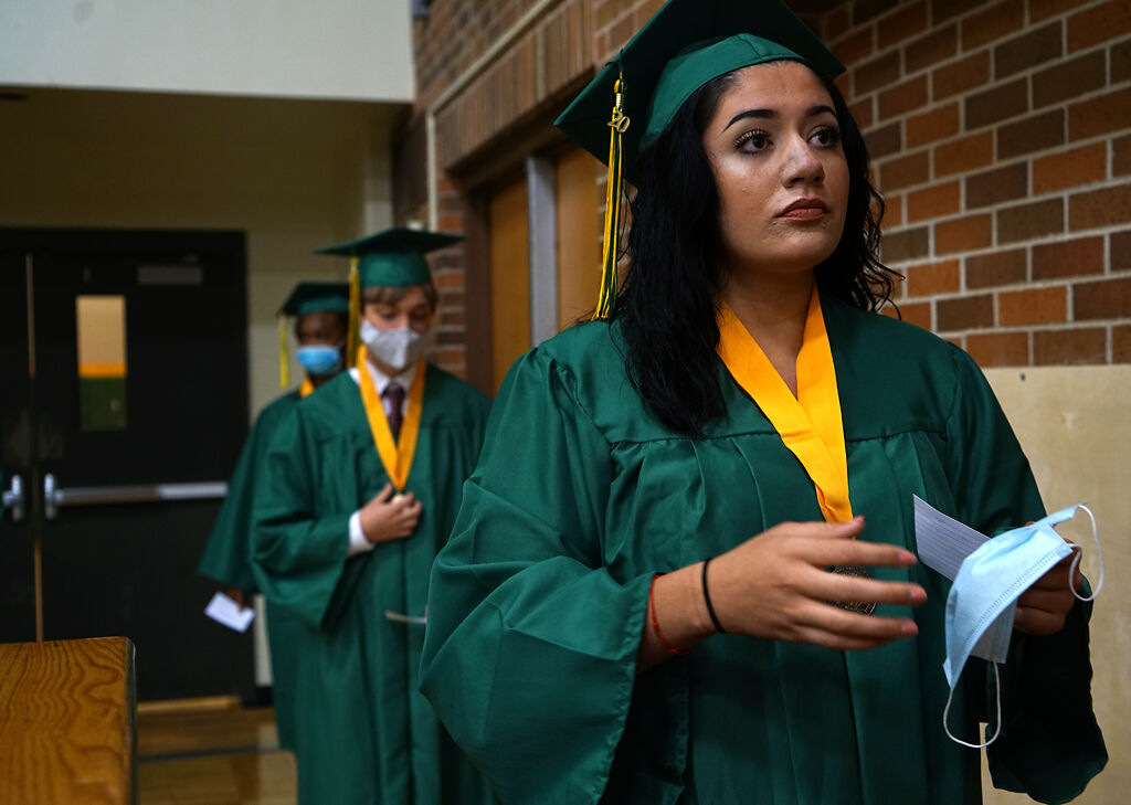 Isabella Garfias prepares to step on to stage to have a picture with the Principal, Jacob Sirna